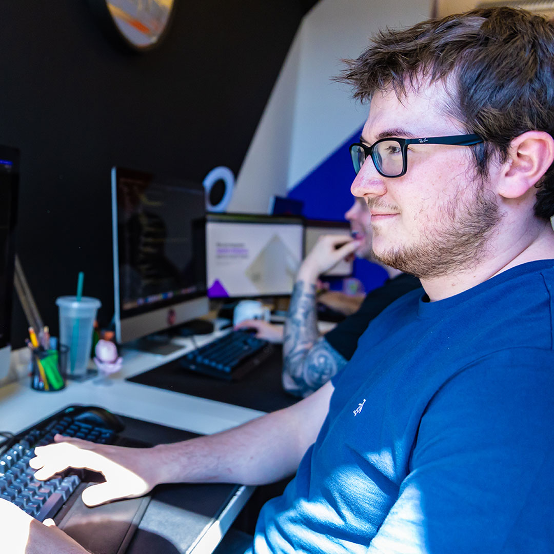 An image of the BurstingBox team working at their office.