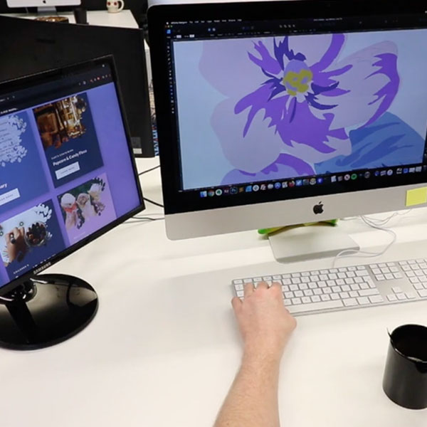 An image of BurstingBox digitally designing logos.