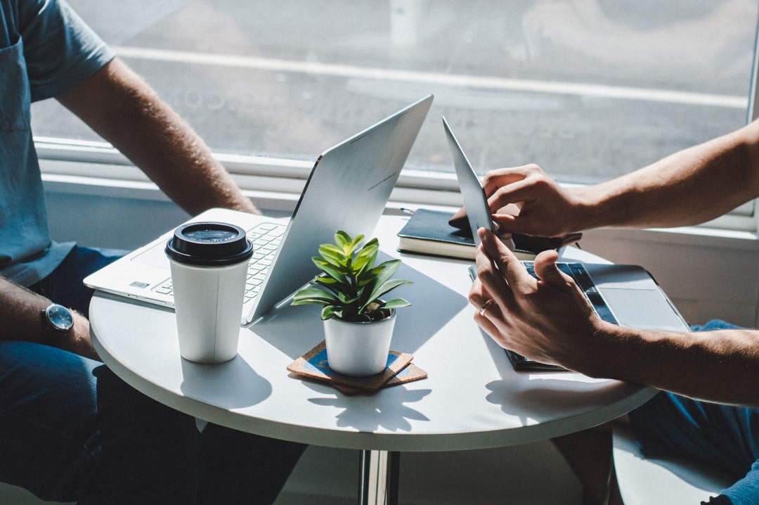 An image of two people having a meeting.