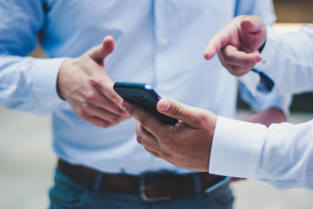 An image of two people discussing a website.