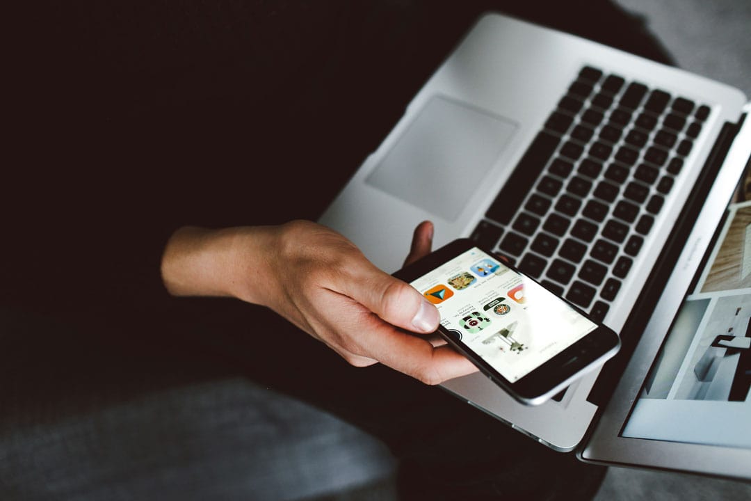 An image of a person viewing a website on a mobile.