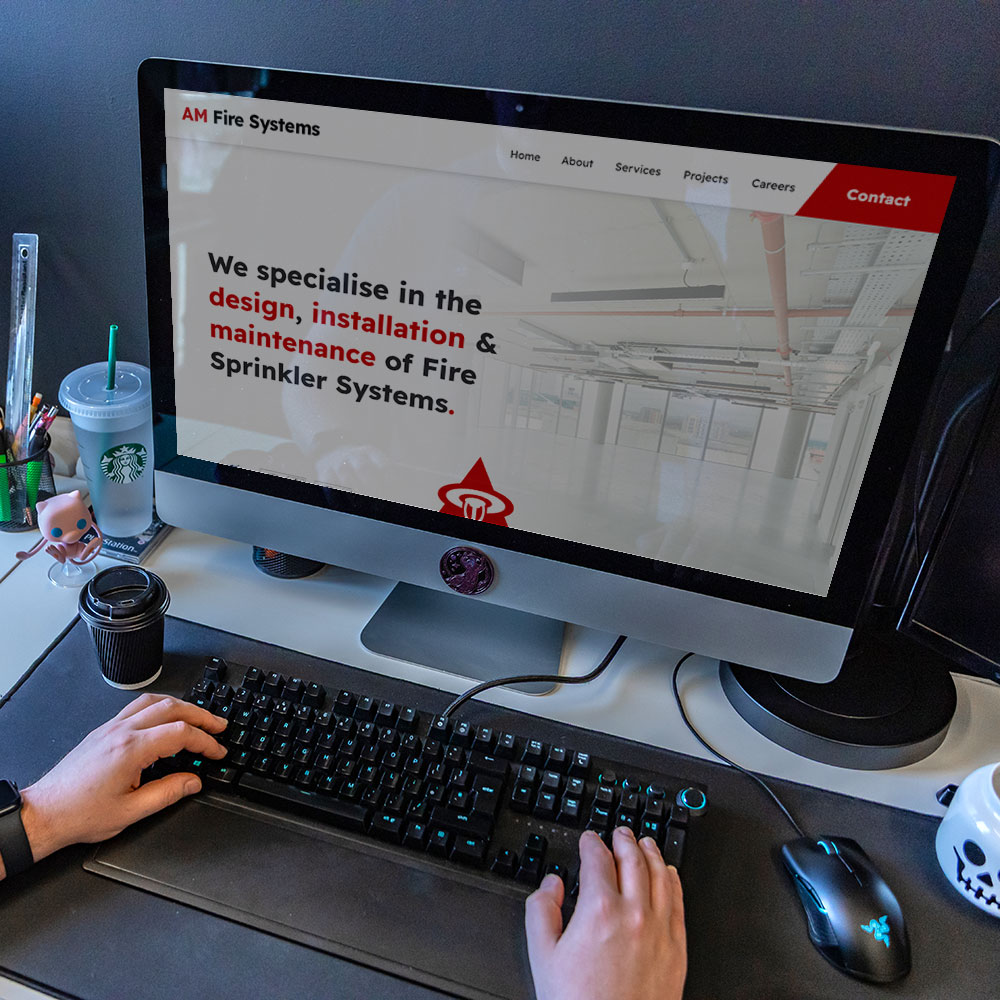 An image of the AM Fire Systems website on a computer.