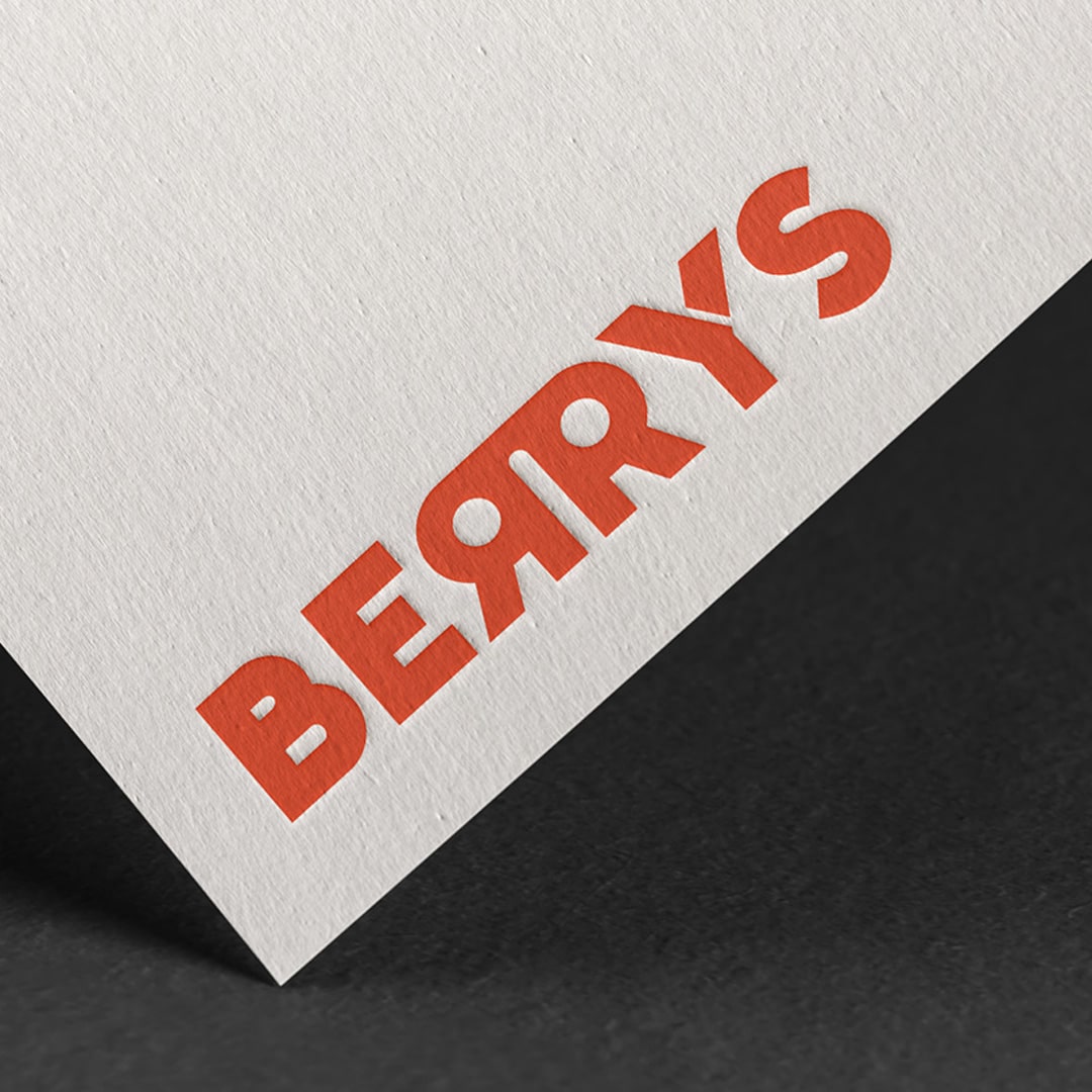 An image of the Berry's logo printed on paper.