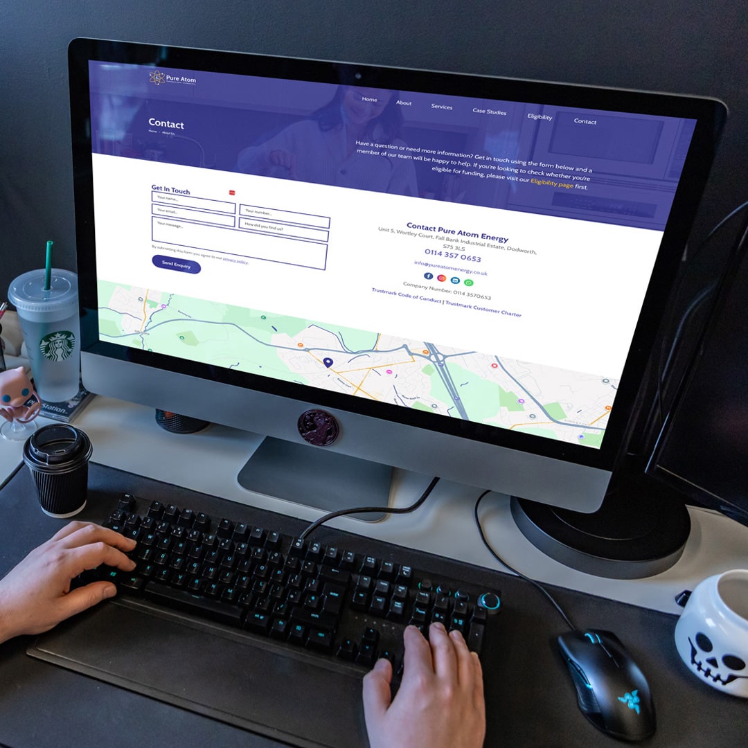 An image of the Pure Atom website on a computer.