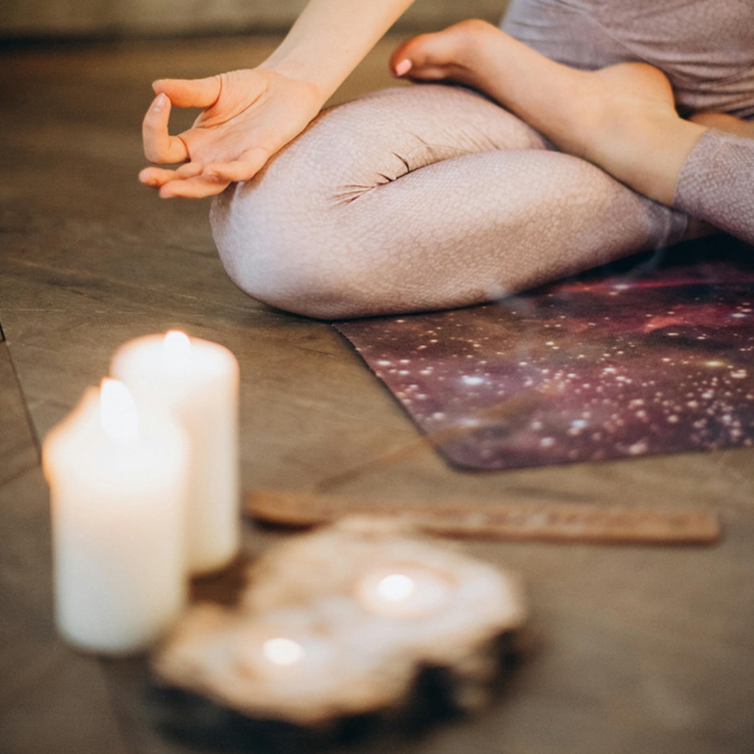 An image of a lady in a yoga pose.