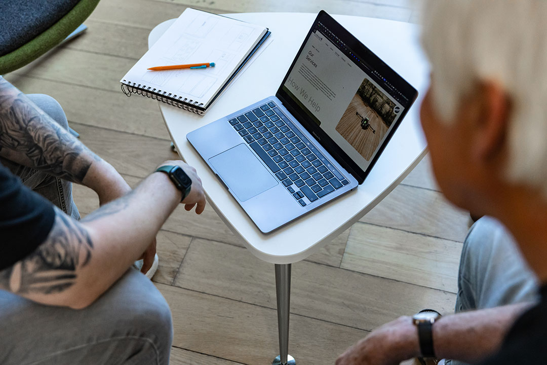 An image of a meeting about website hosting.